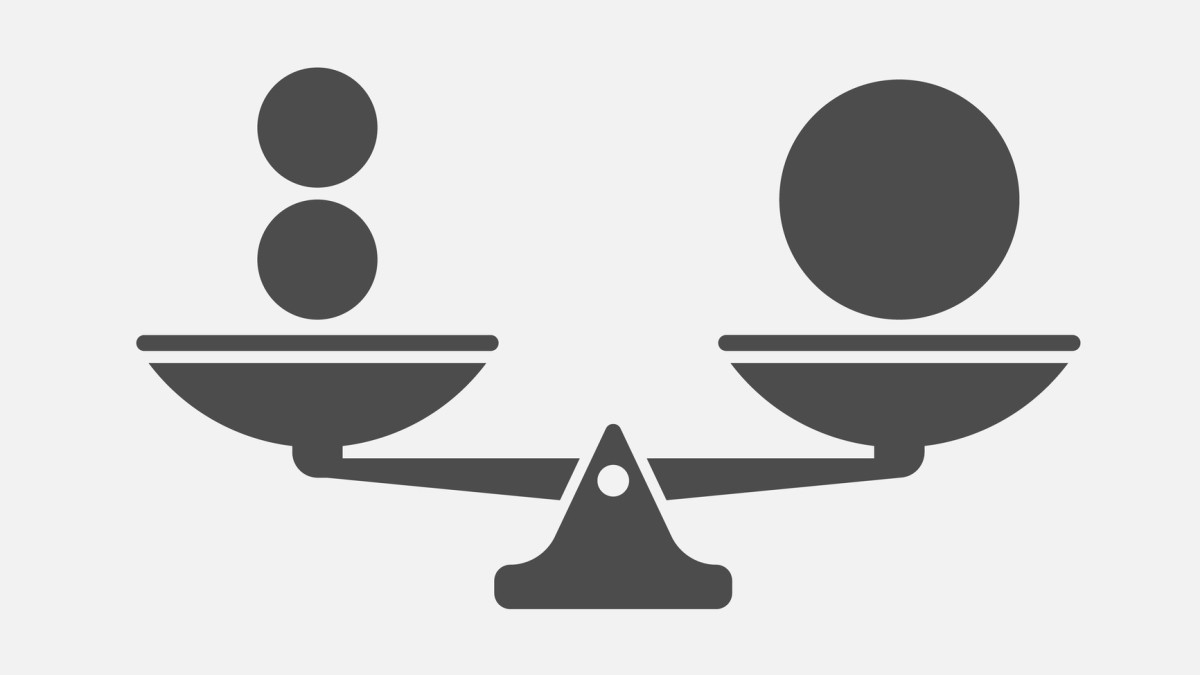 An illustration of a scale holding two small balls and one large ball